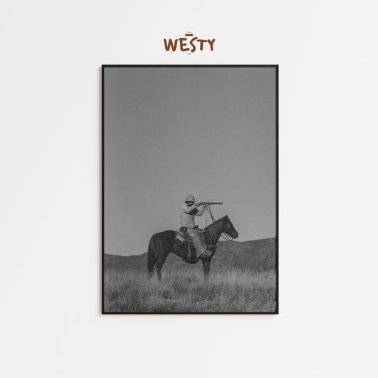 Lone Cowboy with Spyglass – Minimalist Black and White Western Poster