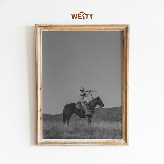Lone Cowboy with Spyglass – Minimalist Black and White Western Poster