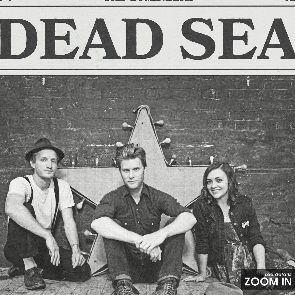 The Lumineers Dead Sea newspaper poster — close-up detail